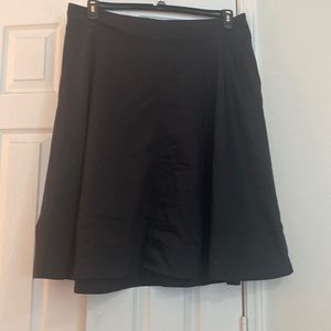 Size 18 Lane Bryant A line black skirt. Has pockets and zips in back.